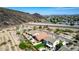A captivating aerial view showing the pool and landscape, nestled against the backdrop of a picturesque desert mountain at 3028 W Parkside Ln, Phoenix, AZ 85027