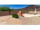 Backyard features fireplace, landscaping, water feature, and block wall at 3028 W Parkside Ln, Phoenix, AZ 85027