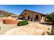 Backyard features landscaping and exterior of home with covered patio at 3028 W Parkside Ln, Phoenix, AZ 85027