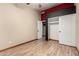 Bedroom features wood-look floors, neutral walls, sliding closet doors and adjoining walk-in closet at 3028 W Parkside Ln, Phoenix, AZ 85027