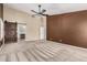 Spacious bedroom with a wood barn door leading to the main bathroom and vaulted ceilings at 3028 W Parkside Ln, Phoenix, AZ 85027