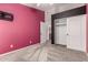 Bedroom featuring carpeted floors, painted accent wall, and a sliding closet door at 3028 W Parkside Ln, Phoenix, AZ 85027