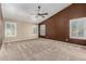 Bright bedroom featuring neutral carpeting, ample natural light, and ceiling fan at 3028 W Parkside Ln, Phoenix, AZ 85027