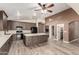 Spacious kitchen featuring a large island, stainless steel appliances, and wood-look tile flooring at 3028 W Parkside Ln, Phoenix, AZ 85027
