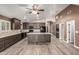 Spacious kitchen features dark wood cabinets, large island, and open layout, perfect for entertaining at 3028 W Parkside Ln, Phoenix, AZ 85027