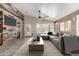 Cozy living room showcases wood accent wall with fireplace, tile floors, and ample natural light at 3028 W Parkside Ln, Phoenix, AZ 85027
