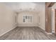 Bright living room boasts tile floors and plantation shutters for a modern and airy feel at 3028 W Parkside Ln, Phoenix, AZ 85027