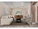 Bright living room with wood floors, neutral paint, shutters, and stylish decor at 3028 W Parkside Ln, Phoenix, AZ 85027