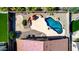 The backyard features a freeform pool, lounge area, and well-manicured landscaping for outdoor living at 3028 W Parkside Ln, Phoenix, AZ 85027