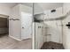 Modern glass walk-in shower with decorative tile and updated fixtures and linen closet at 3028 W Parkside Ln, Phoenix, AZ 85027