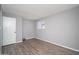 Neutrally painted bedroom with plank flooring, window, and closet with sliding door at 3230 E Pinchot Ave # 32, Phoenix, AZ 85018