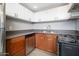 Well-equipped kitchen featuring stainless steel dishwasher, countertops, and ample cabinet space at 3230 E Pinchot Ave # 32, Phoenix, AZ 85018