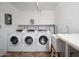 Laundry facility with coin operated washers, dryers, and utility sink at 3230 E Pinchot Ave # 32, Phoenix, AZ 85018