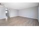 Spacious living room featuring hardwood floors and neutral-colored walls at 3230 E Pinchot Ave # 32, Phoenix, AZ 85018