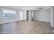 Open-concept living room featuring wood floors, neutral paint, and bright natural light at 3230 E Pinchot Ave # 32, Phoenix, AZ 85018