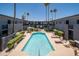 Refreshing community pool with lounge chairs and lush landscaping at 3230 E Pinchot Ave # 32, Phoenix, AZ 85018