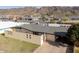 Aerial view of a ranch style home with a grey roof with mountain views at 327 E Monte Way, Phoenix, AZ 85042