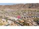 Expansive aerial shot of a vibrant neighborhood nestled against a scenic mountain backdrop at 327 E Monte Way, Phoenix, AZ 85042