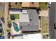 Aerial view of backyard oasis complete with pool, palm trees and patio at 327 E Monte Way, Phoenix, AZ 85042