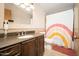 Bathroom with granite vanity top and rainbow shower curtain at 327 E Monte Way, Phoenix, AZ 85042