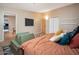 Bedroom featuring a decorative rug, walk-in closets, and a queen-sized bed at 327 E Monte Way, Phoenix, AZ 85042
