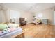 Bedroom with hardwood floors, ceiling fan, and two twin beds at 327 E Monte Way, Phoenix, AZ 85042