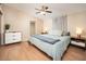 Inviting bedroom with soft natural light, laminate wood floors, and tasteful decor, perfect for relaxation and restful nights at 327 E Monte Way, Phoenix, AZ 85042