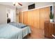 Cozy bedroom with light neutral walls, modern built-in closets, and comfortable bedding for a relaxing retreat at 327 E Monte Way, Phoenix, AZ 85042