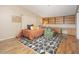Bedroom featuring a decorative rug, built-in shelves, and a queen-sized bed at 327 E Monte Way, Phoenix, AZ 85042