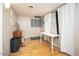Versatile bonus room with wood floors, neutral tones, and natural light, suitable for an office, studio, or hobby space at 327 E Monte Way, Phoenix, AZ 85042
