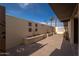 Cozy courtyard with pavers, outdoor furniture, block walls and desert landscaping at 327 E Monte Way, Phoenix, AZ 85042