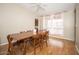 Dining room with wood floors, bright windows, and comfortable seating, perfect for Gathering meals and gatherings at 327 E Monte Way, Phoenix, AZ 85042