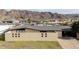 Ranch style home featuring block wall, flat roof and low maintenance landscaping at 327 E Monte Way, Phoenix, AZ 85042