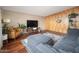 Cozy living room with wood paneling, plush seating, and ample natural light, creating a comfortable and stylish living space at 327 E Monte Way, Phoenix, AZ 85042