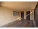 Enclosed patio with brick walls, concrete flooring, and ample natural light, providing a versatile outdoor space at 327 E Monte Way, Phoenix, AZ 85042