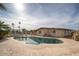 This backyard features a pool and a lawn, perfect for cooling off and enjoying the outdoors at 327 E Monte Way, Phoenix, AZ 85042