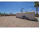 Expansive backyard with a large metal shed, gravel landscaping, and block fencing at 3362 E Carol Ave, Mesa, AZ 85204