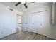 This bedroom features wood-look flooring and a neutral color palette, offering a calm and inviting atmosphere at 3362 E Carol Ave, Mesa, AZ 85204