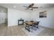 Dining area featuring a wood table, black chairs, and neutral decor with tile flooring and ceiling fan at 3362 E Carol Ave, Mesa, AZ 85204