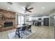 Open dining area with a fireplace, seamlessly connecting to the kitchen and living spaces at 3362 E Carol Ave, Mesa, AZ 85204