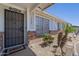 Inviting front entry featuring a security door and desert-friendly landscaping at 3362 E Carol Ave, Mesa, AZ 85204