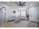 Bright living room featuring tile floors, a ceiling fan, and neutral decor at 3362 E Carol Ave, Mesa, AZ 85204