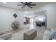 Open concept living area with tile flooring leading to the kitchen and dining spaces at 3362 E Carol Ave, Mesa, AZ 85204