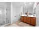 Bright bathroom features dual sinks, large mirror, separate shower, and tub for a relaxing experience at 36515 N Takota Trl, San Tan Valley, AZ 85140