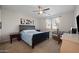 Bright bedroom features a comfortable bed, a ceiling fan, and a carpet at 36515 N Takota Trl, San Tan Valley, AZ 85140