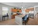 Spacious kitchen with an island, stainless steel appliances, wood cabinets, granite countertops, and stylish seating at 36515 N Takota Trl, San Tan Valley, AZ 85140