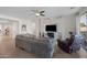Bright living room featuring a fireplace, stylish decor, and comfortable seating at 36515 N Takota Trl, San Tan Valley, AZ 85140