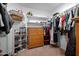 Spacious walk-in closet with shelving, racks, and storage for organized wardrobe and accessories at 36515 N Takota Trl, San Tan Valley, AZ 85140