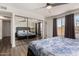 Bright bedroom with mirrored closet, neutral walls, wood floors and large windows at 3765 W Wood Dr, Phoenix, AZ 85029