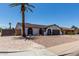 Single-story home with a well-maintained front yard, desert landscaping, and a two-car garage at 3765 W Wood Dr, Phoenix, AZ 85029